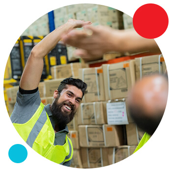 Photo of a man in a warehouse setting doing stretching exercises